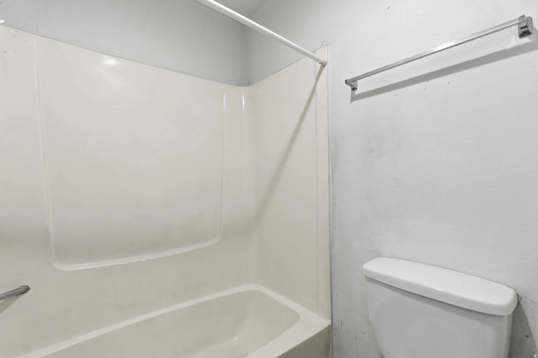 Full bath with toilet and shower / bath combination