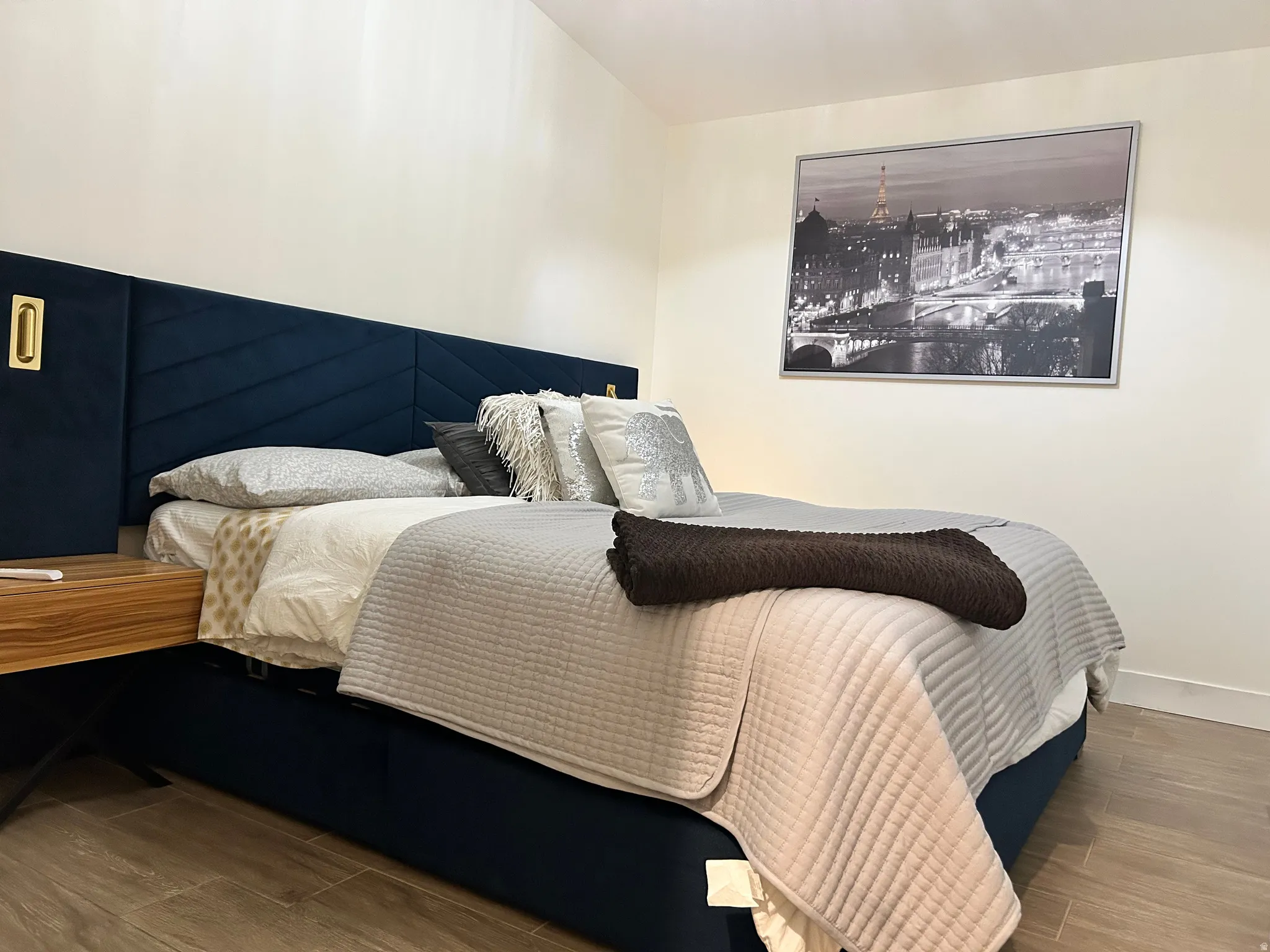Bedroom featuring wood tiled floors and baseboards