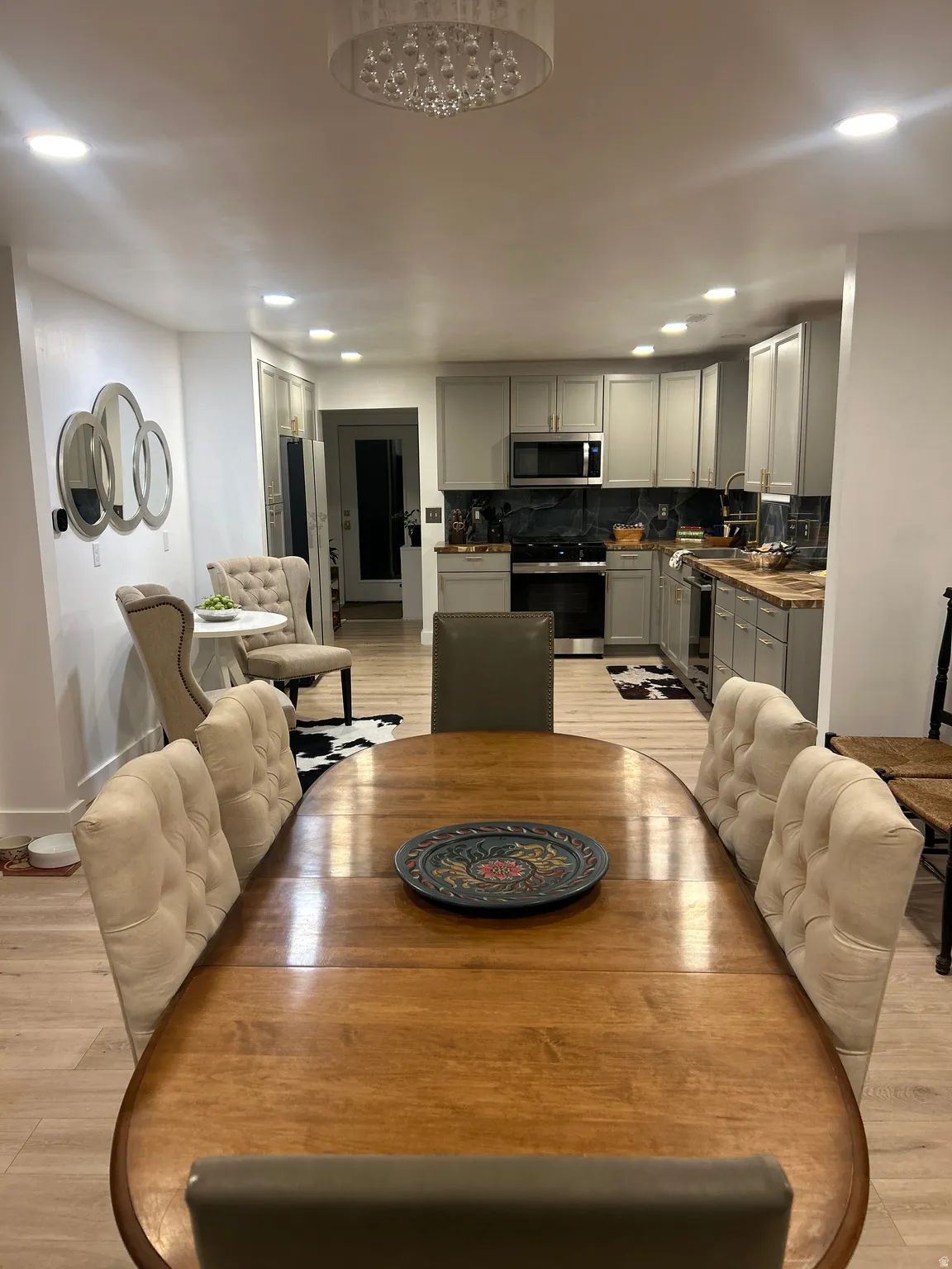 Dining room featuring light wood-style flooring and recessed lighting