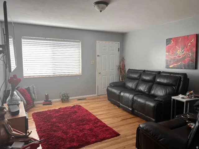Living area with light wood finished floors