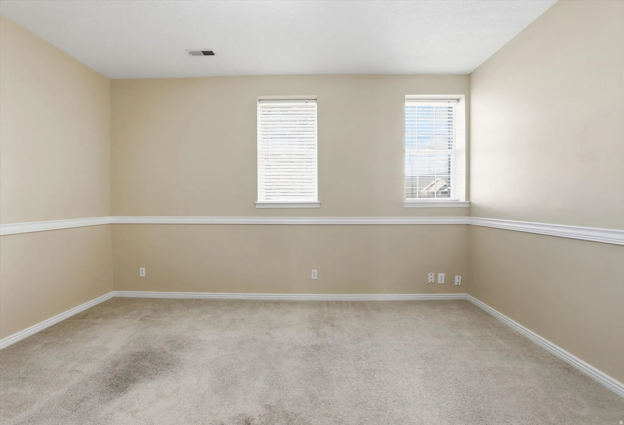 Living room with windows facing west