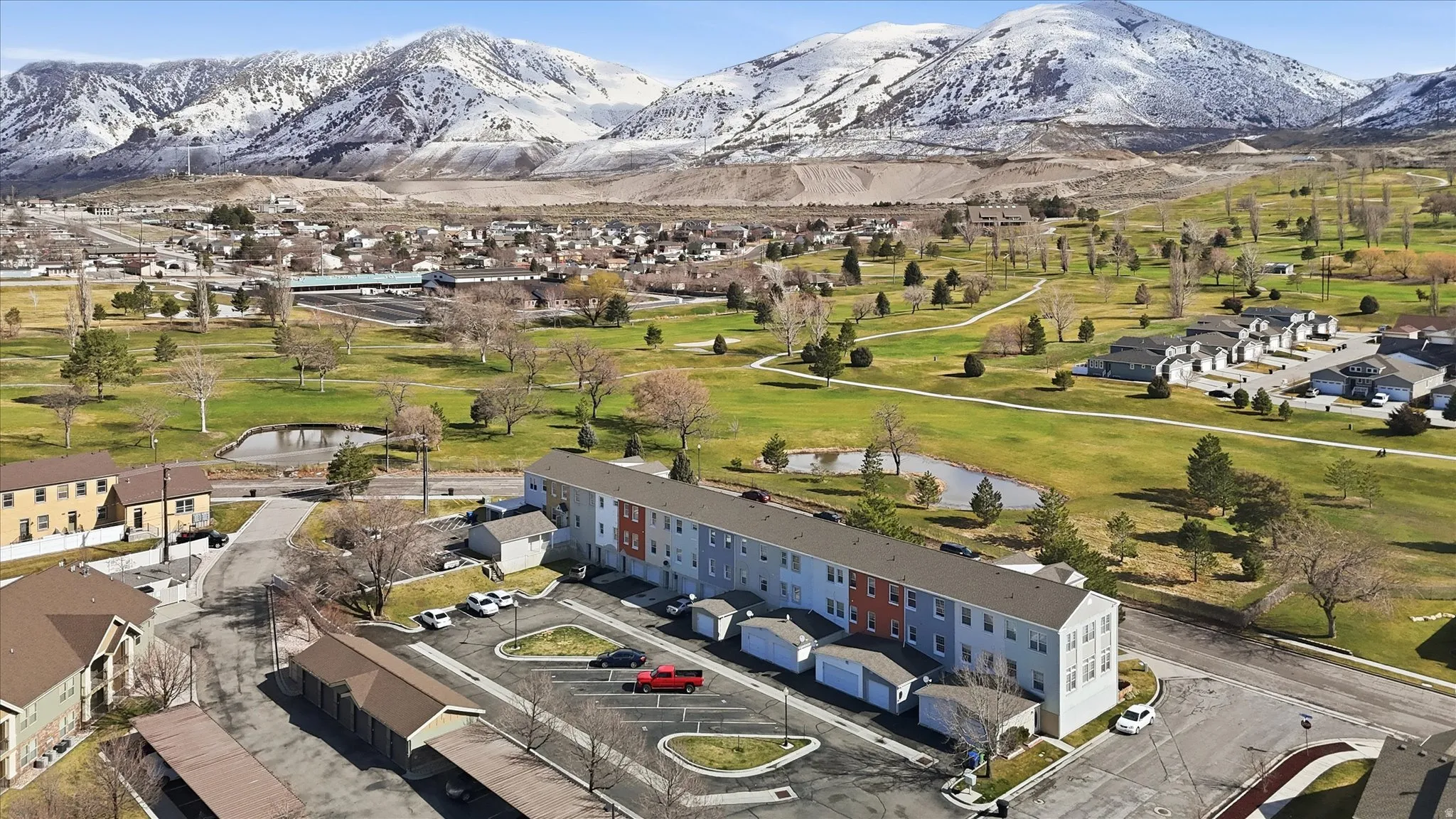 Aerial of back side of townhomes with golf course