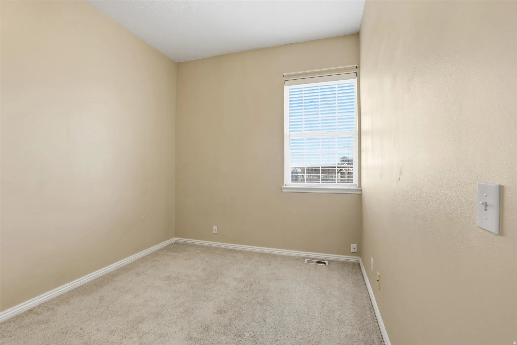 Bedroom with window facing west