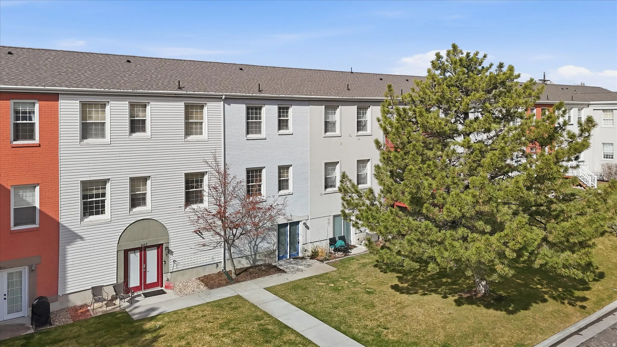 View of building, unit for sale has the blue door