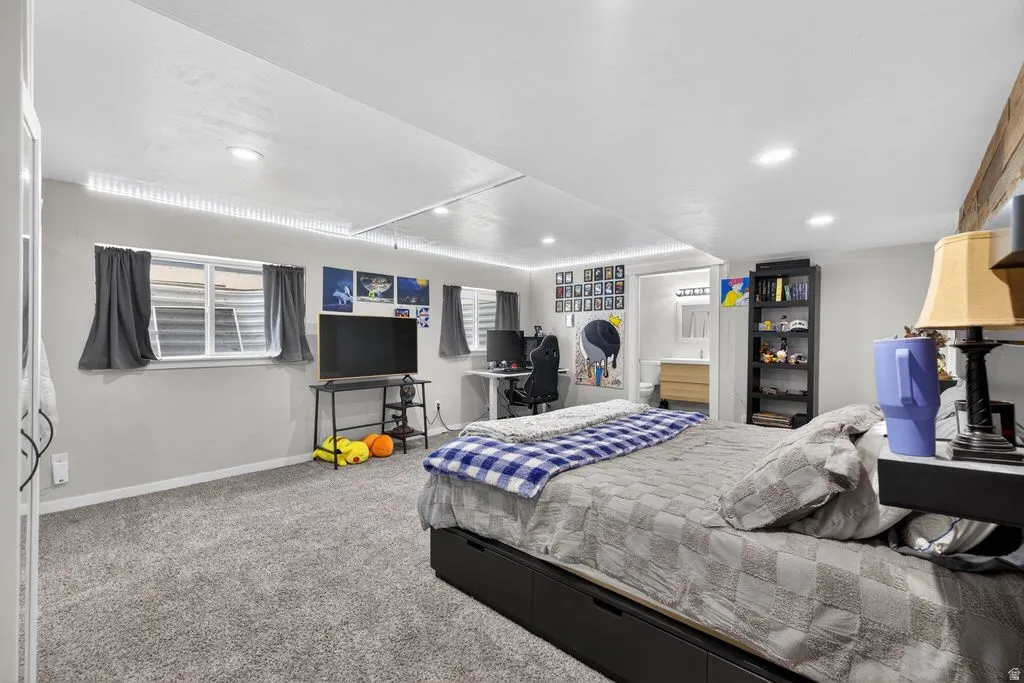 Carpeted bedroom featuring recessed lighting