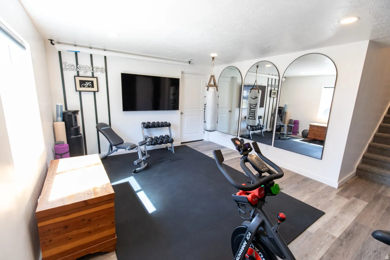 Exercise area featuring recessed lighting