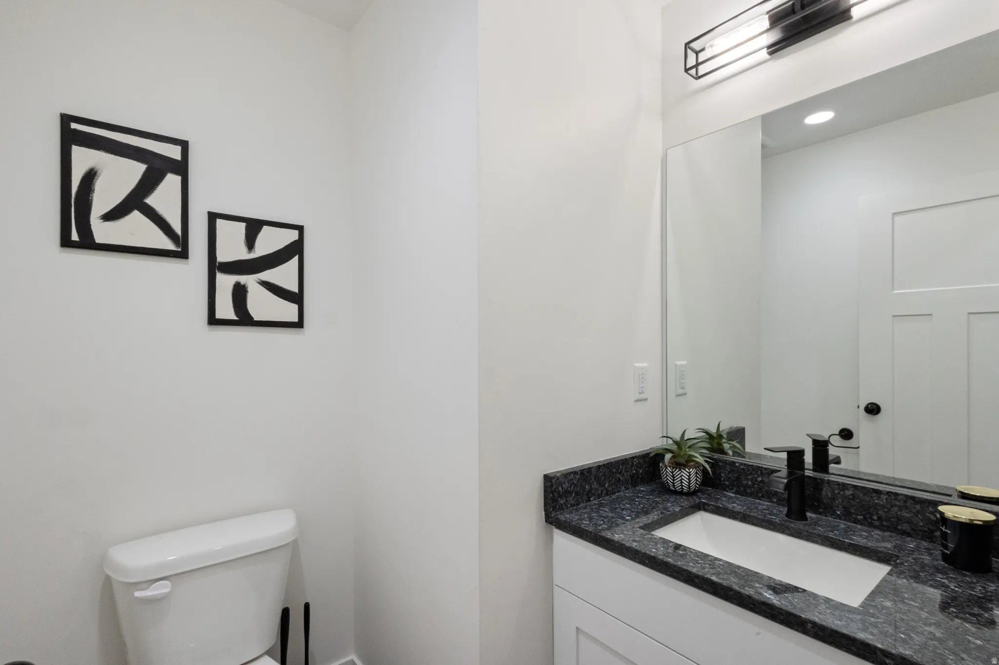 Bathroom with vanity and toilet