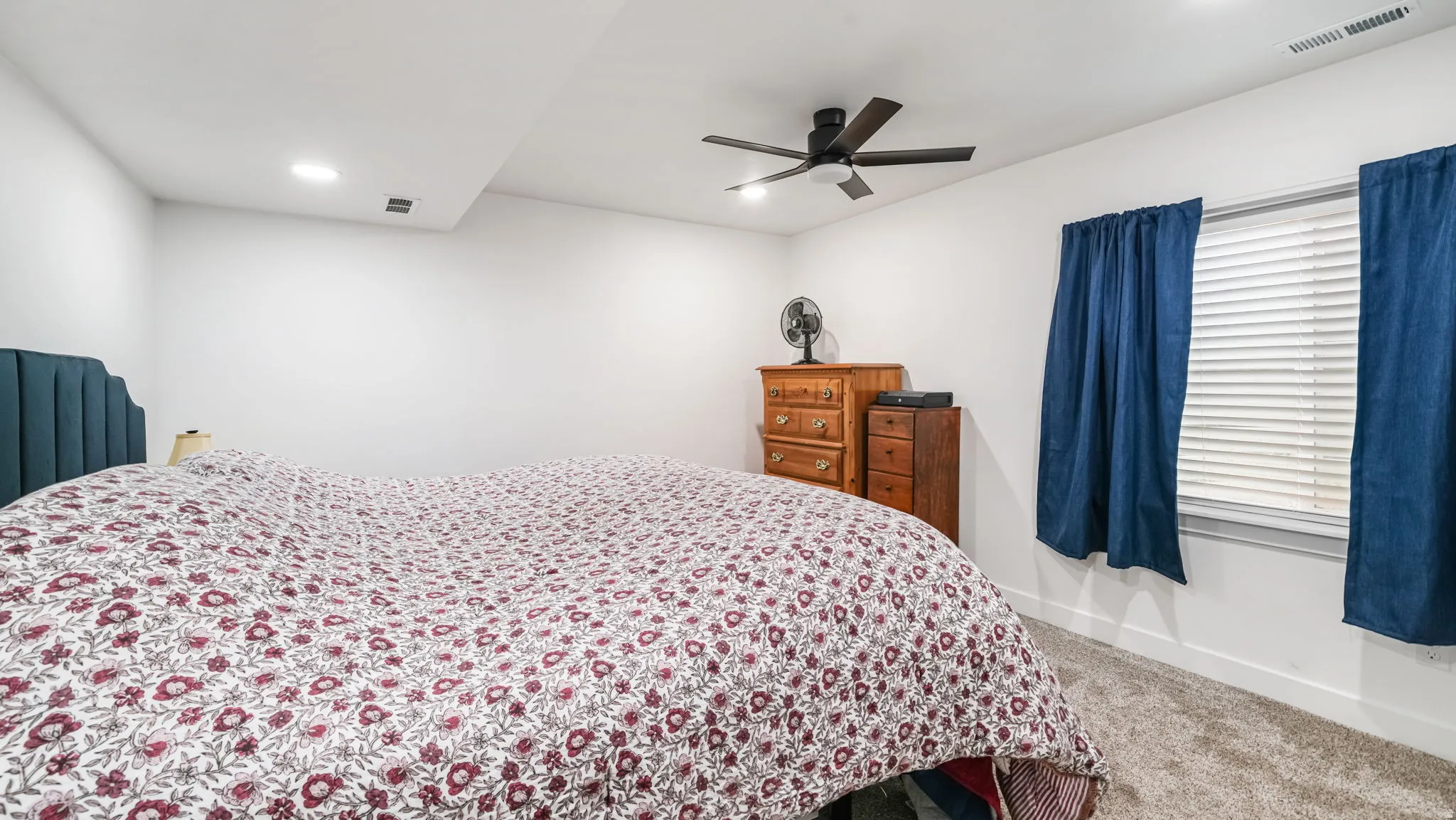 Bedroom featuring carpet flooring, ceiling fan, and recessed lighting
