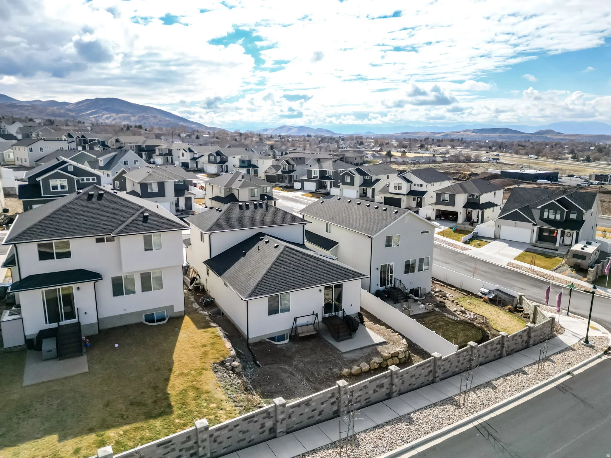 Aerial view of residential area with a mountainous background