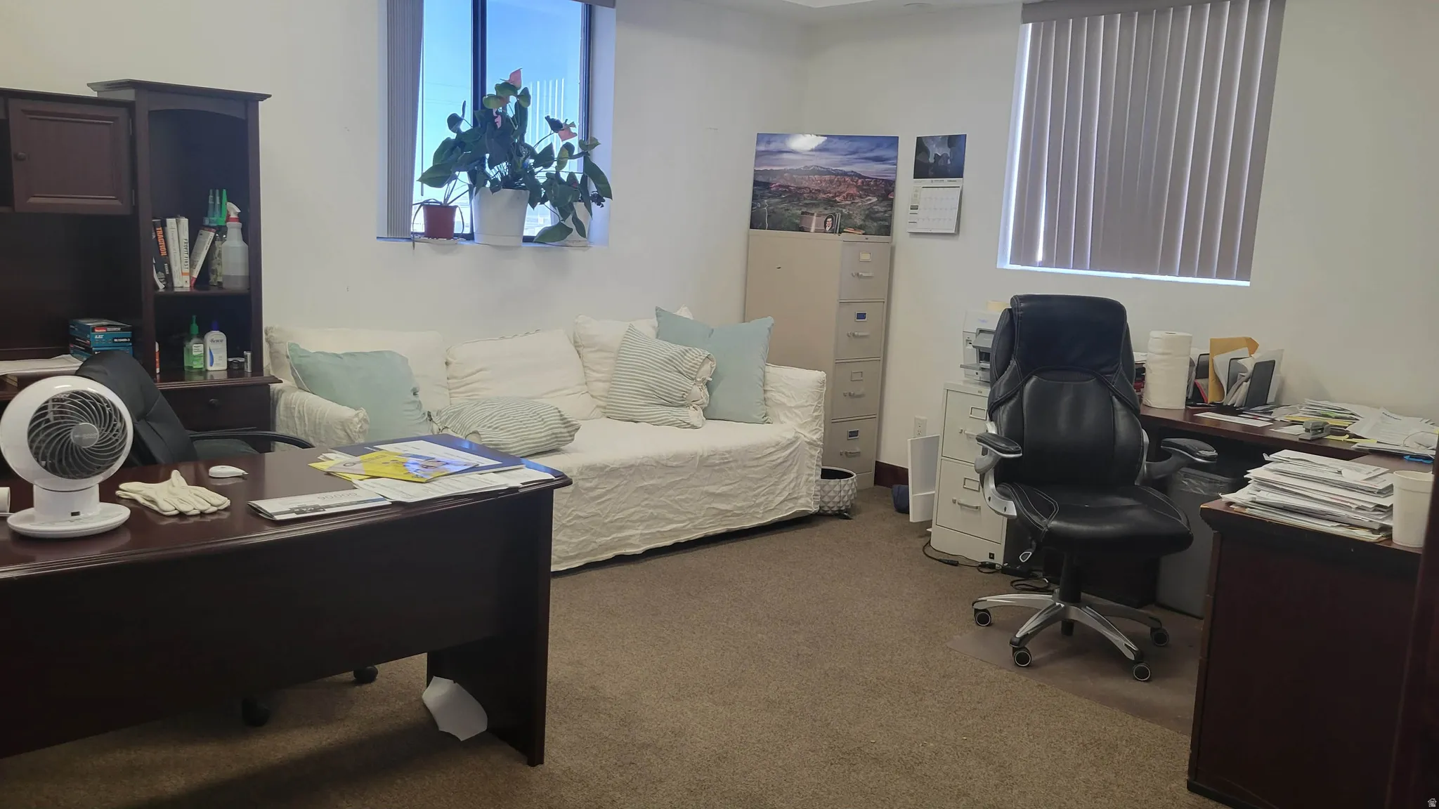 Office area with dark carpet