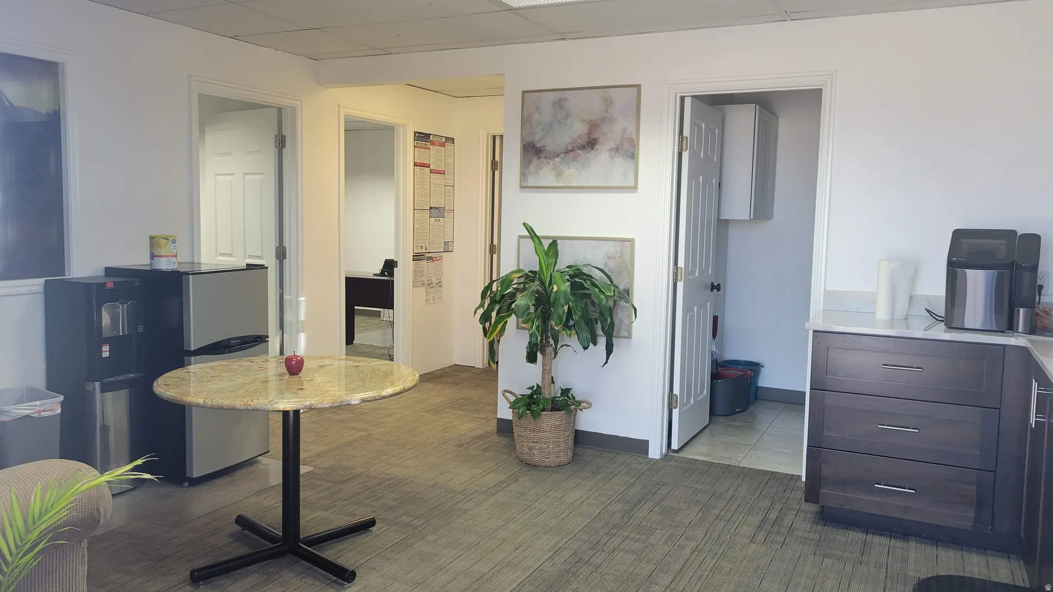 Home office featuring a drop ceiling