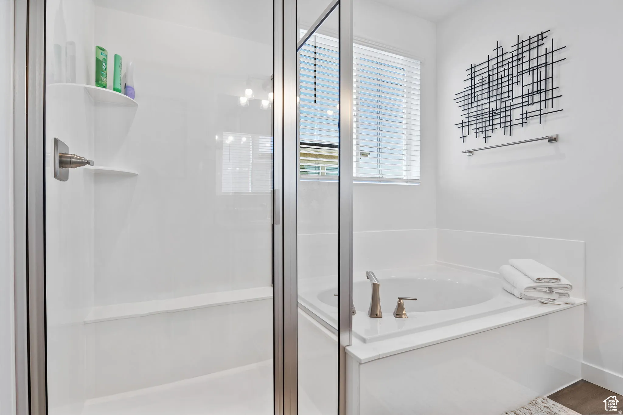 Full bath featuring a stall shower and a garden tub