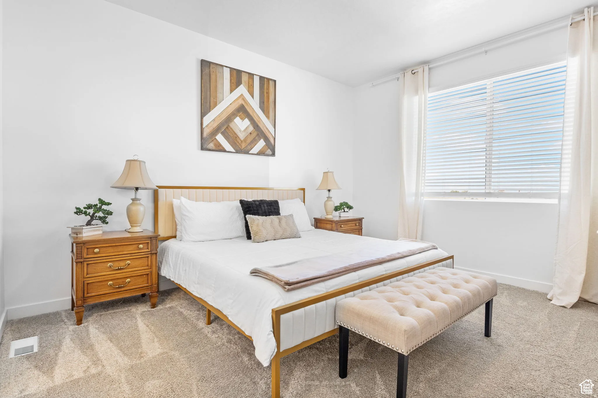 Bedroom with light carpet