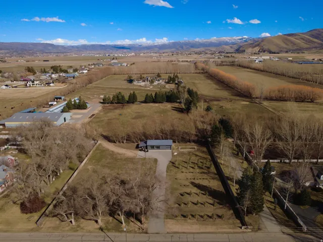 Overview of rural landscape with a mountainous background and extensive farmland