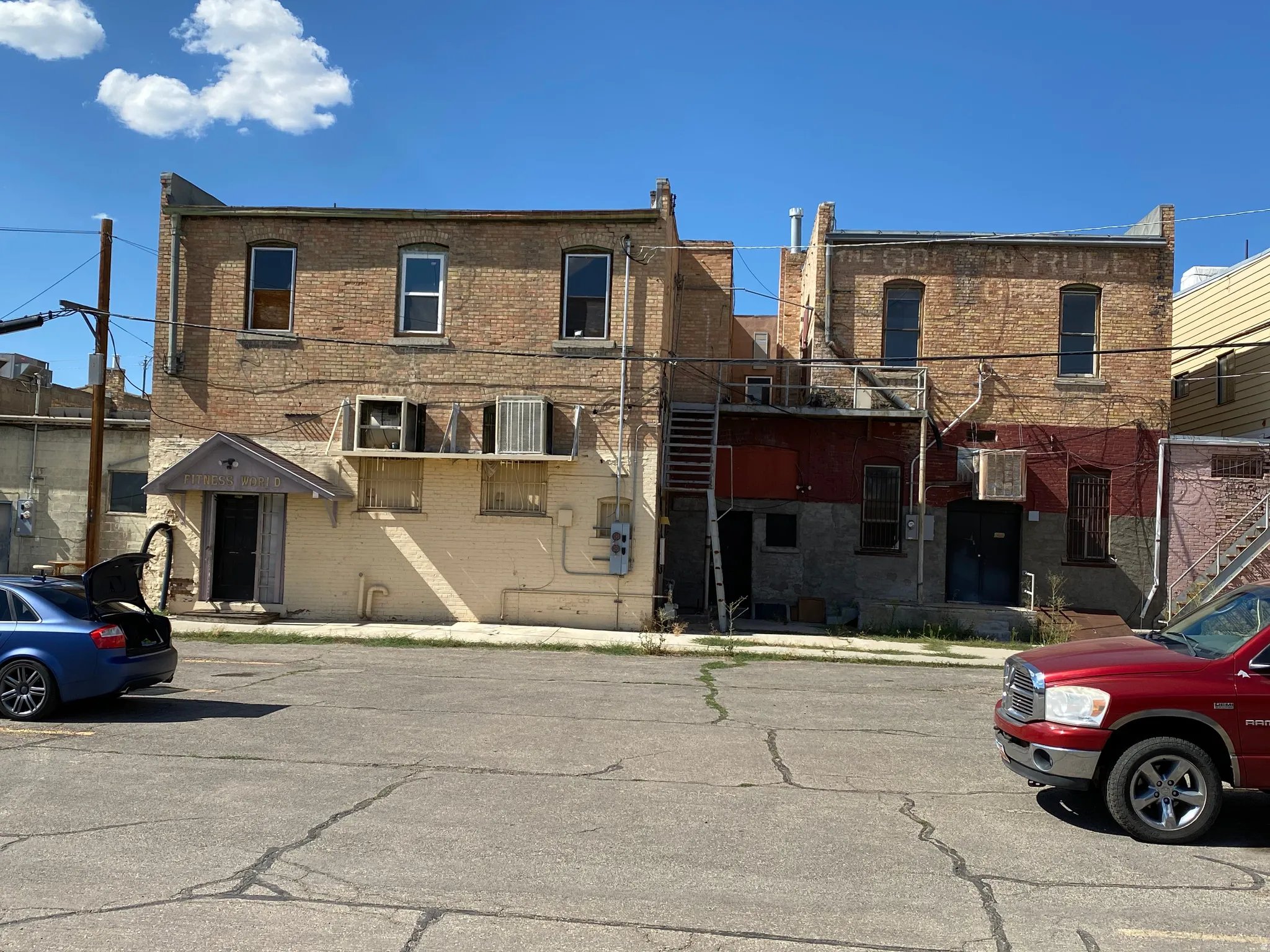 View of front of home featuring brick siding and uncovered parking