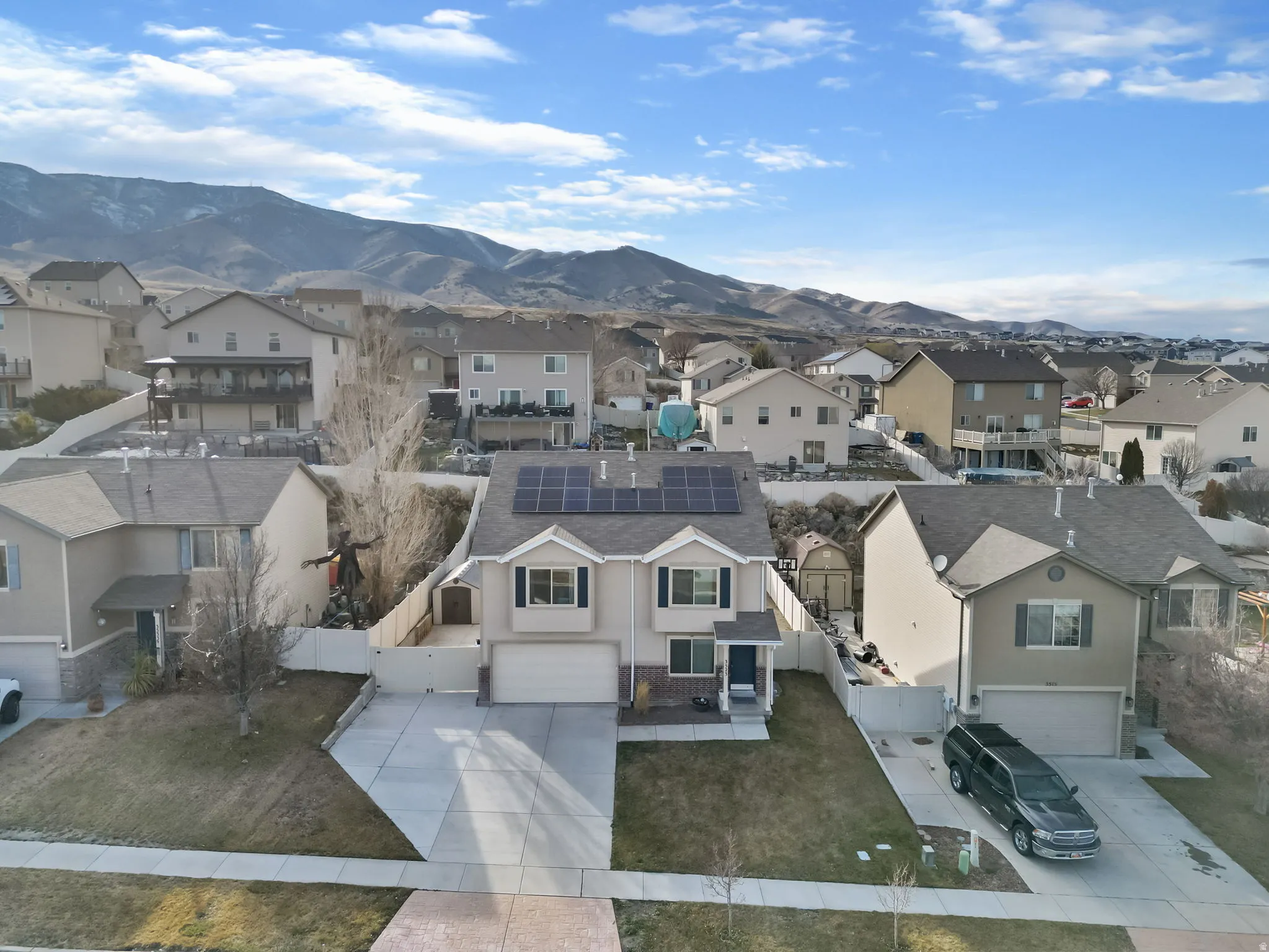 Aerial view of residential area with a mountainous background