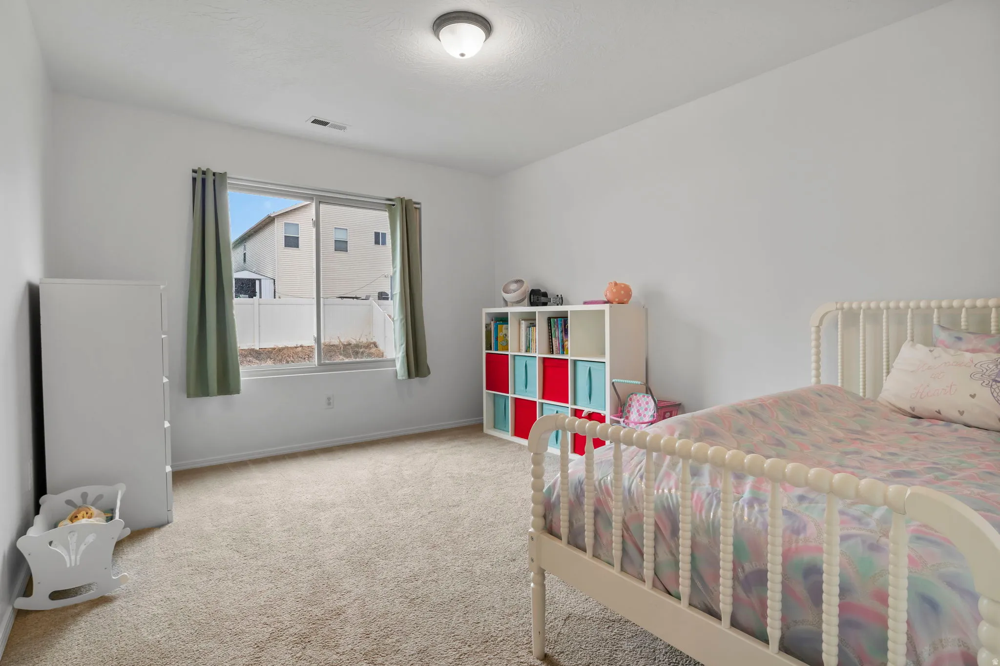 Bedroom with carpet flooring and baseboards