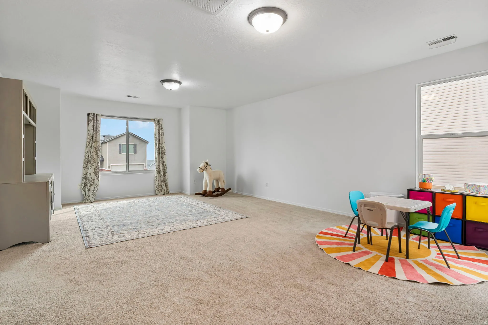 Playroom with carpet and baseboards