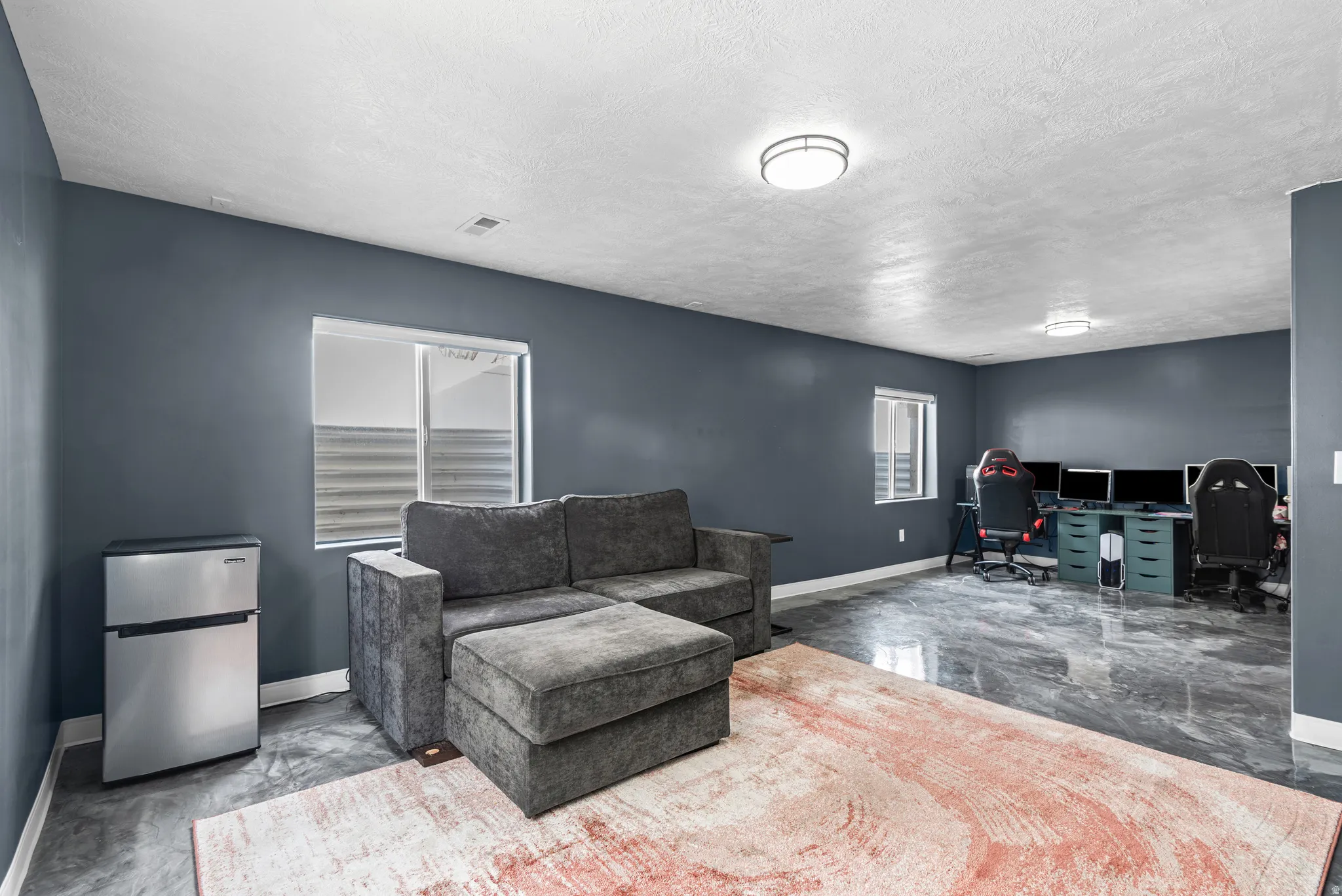 Office space featuring baseboards and a textured ceiling