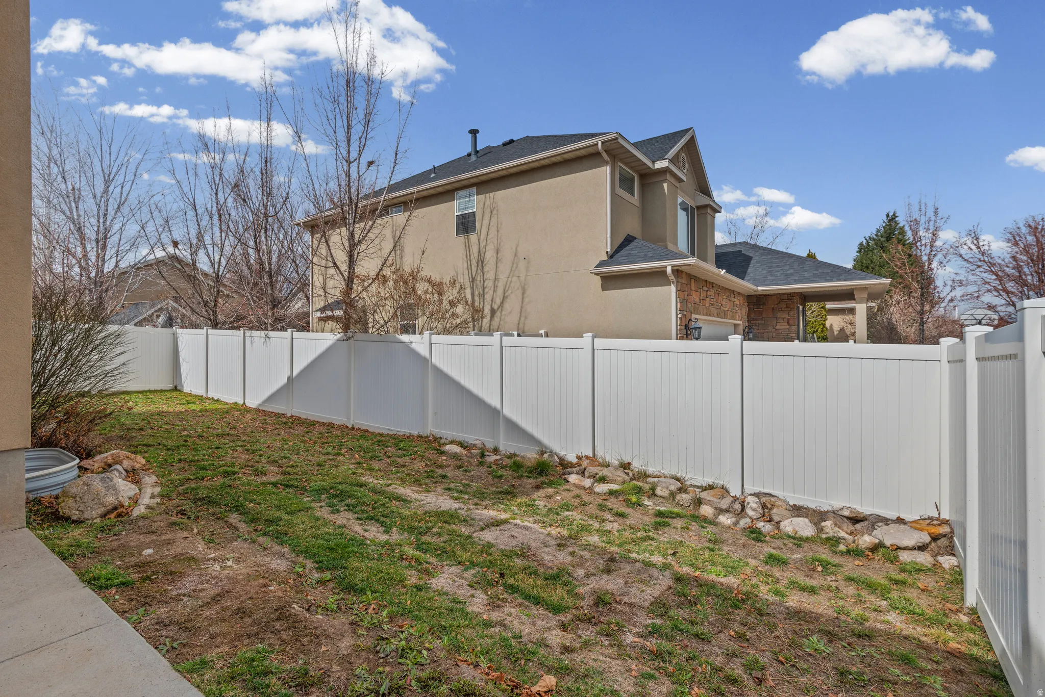 View of fenced backyard