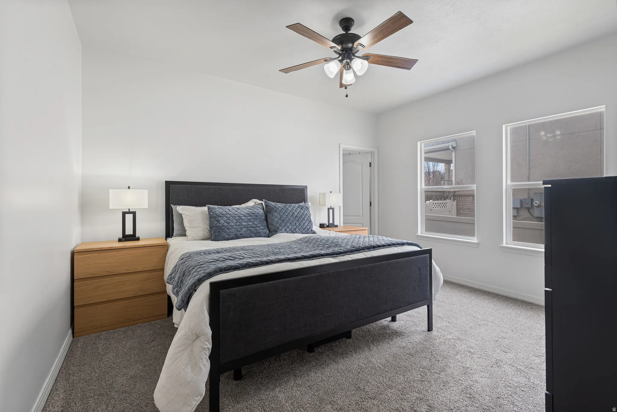 Bedroom with carpet floors and a ceiling fan