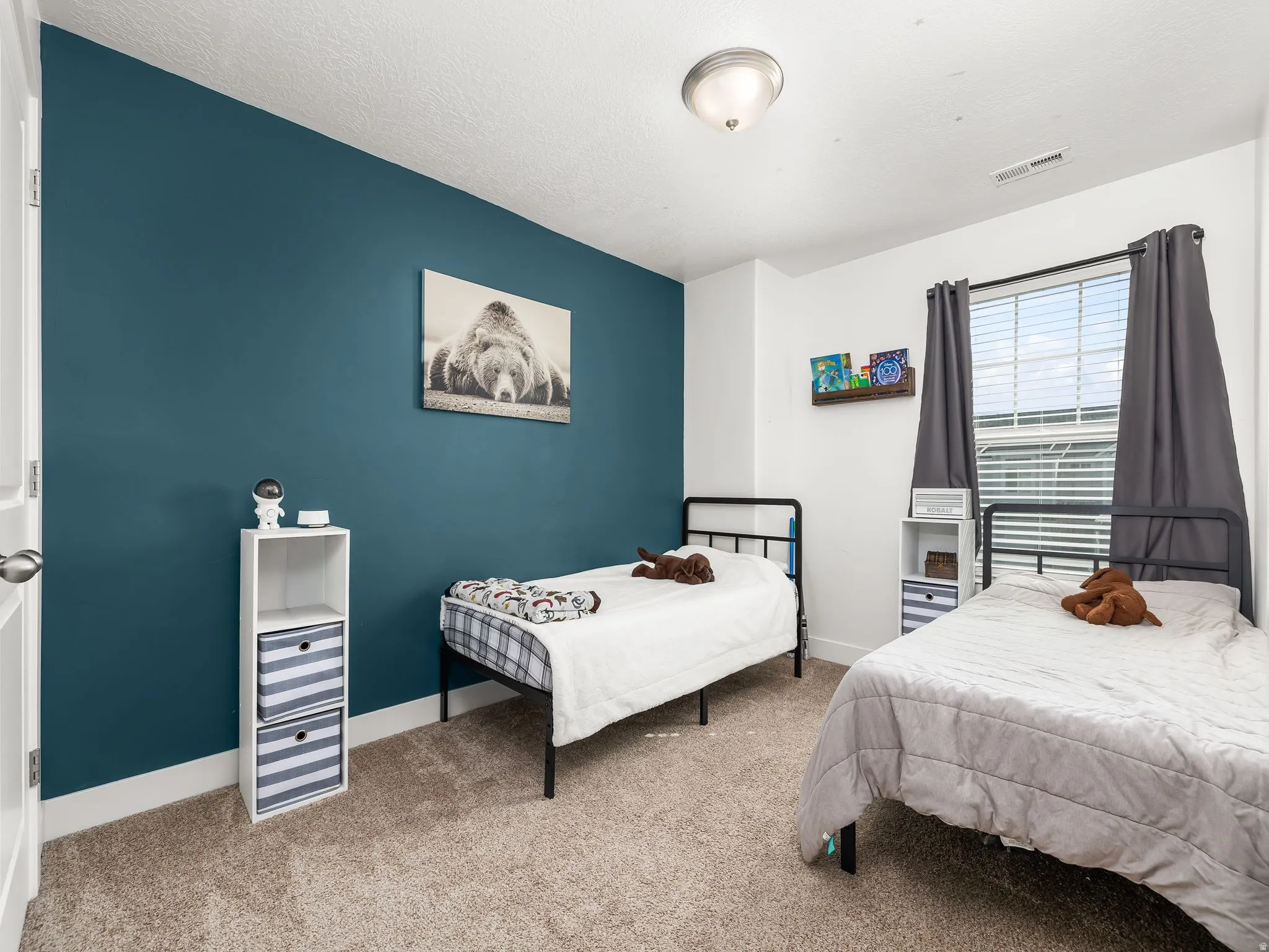 Bedroom with carpet flooring and baseboards