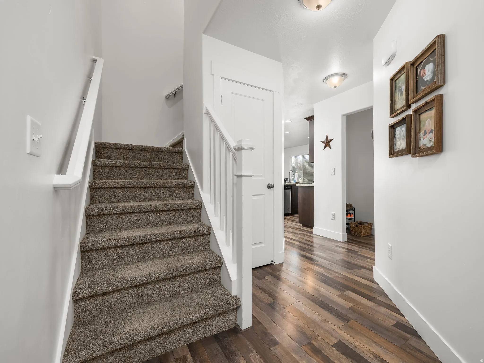 Stairs featuring wood finished floors and baseboards
