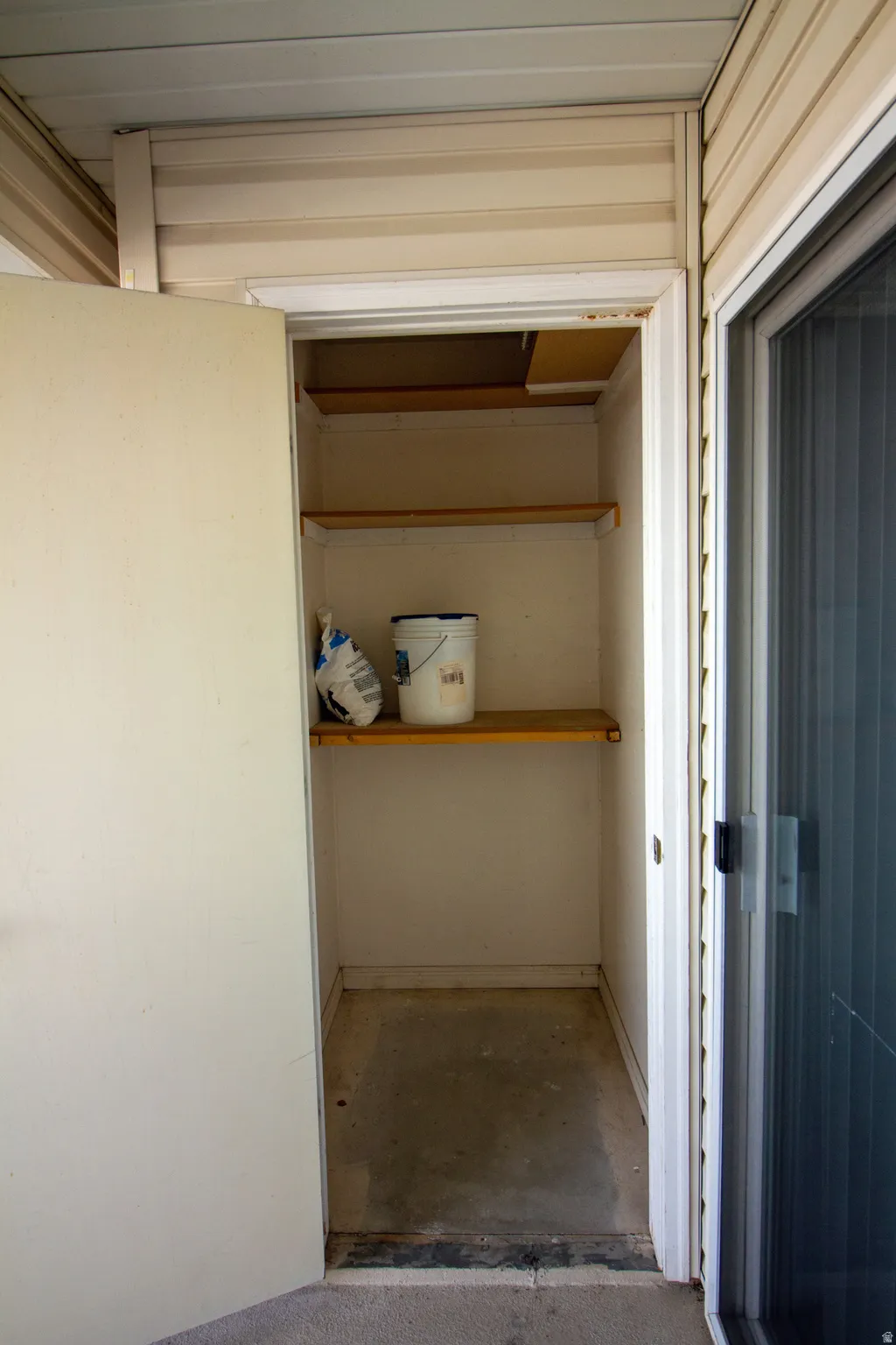 Storage room featuring attic access