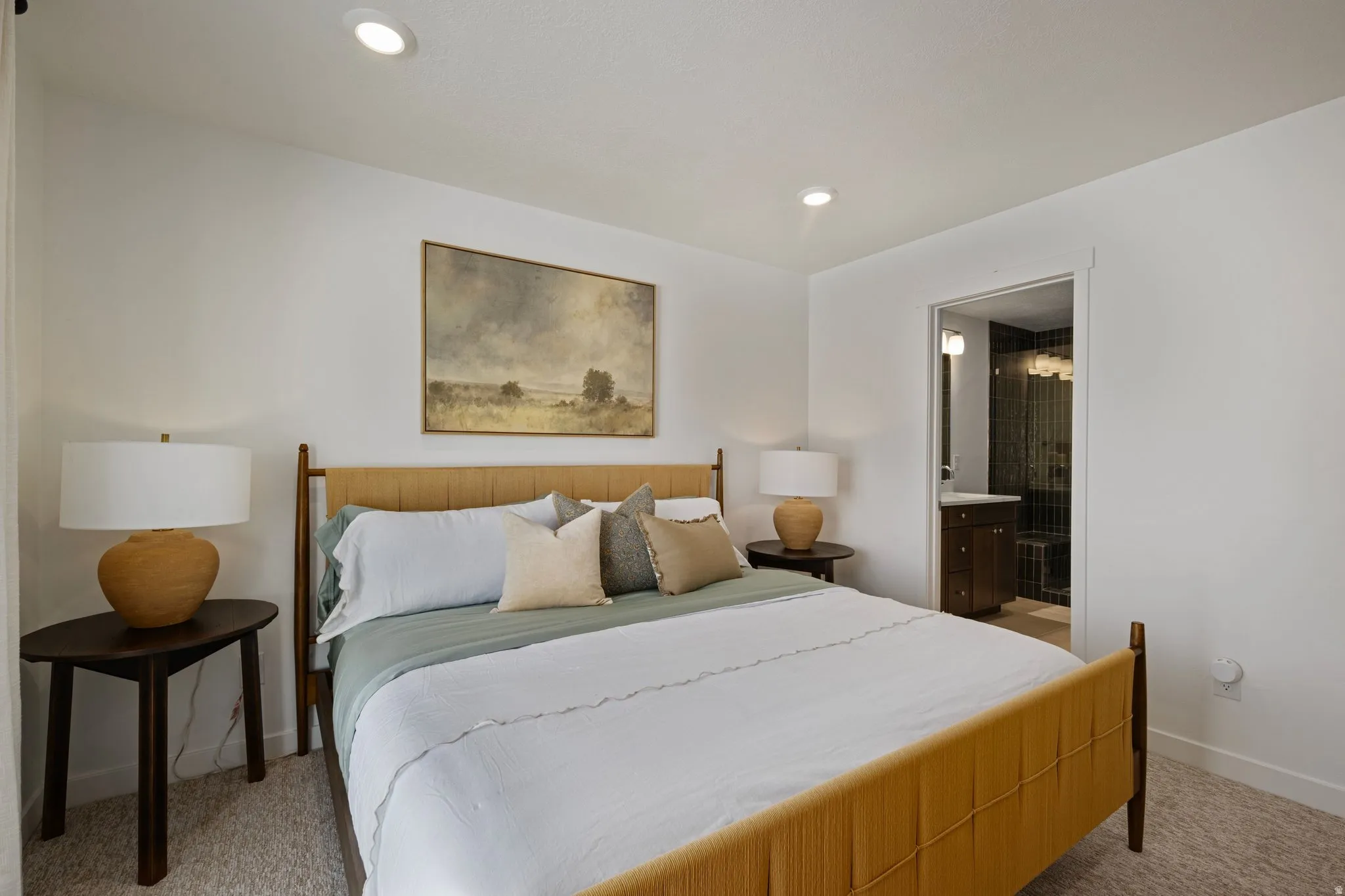Spacious bedroom filled with natural light and calming mountain vibes.