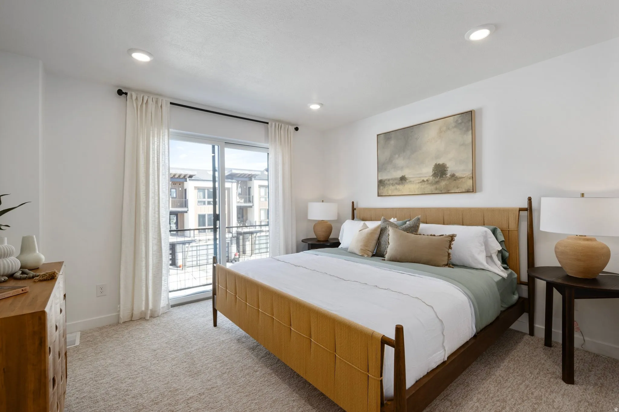 Spacious bedroom filled with natural light and calming mountain vibes.
