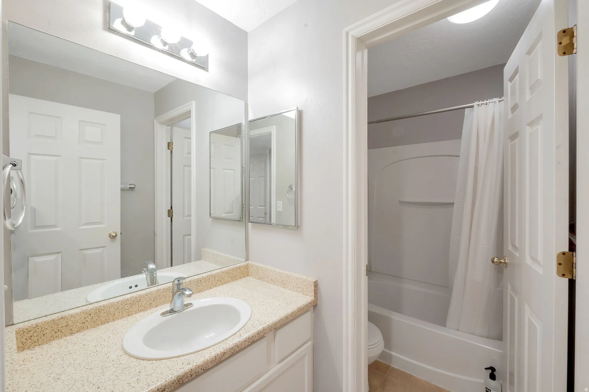 Main Bathroom with separate sink and shower area.