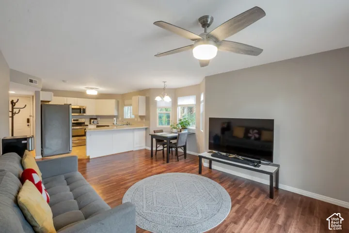 Open-concept living area with wood-finish flooring.