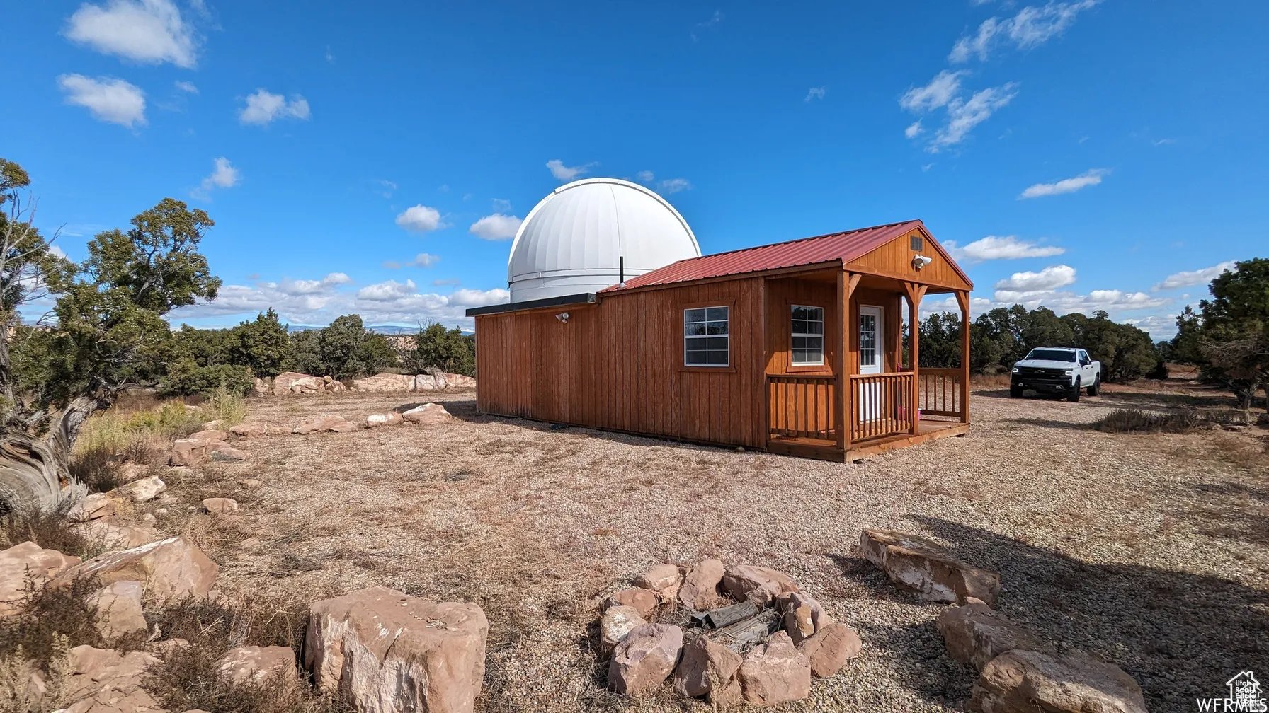 View of side of property with a metal roof