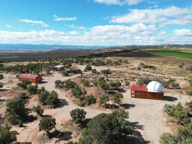 Overview of rural landscape with a desert landscape and a mountain backdrop