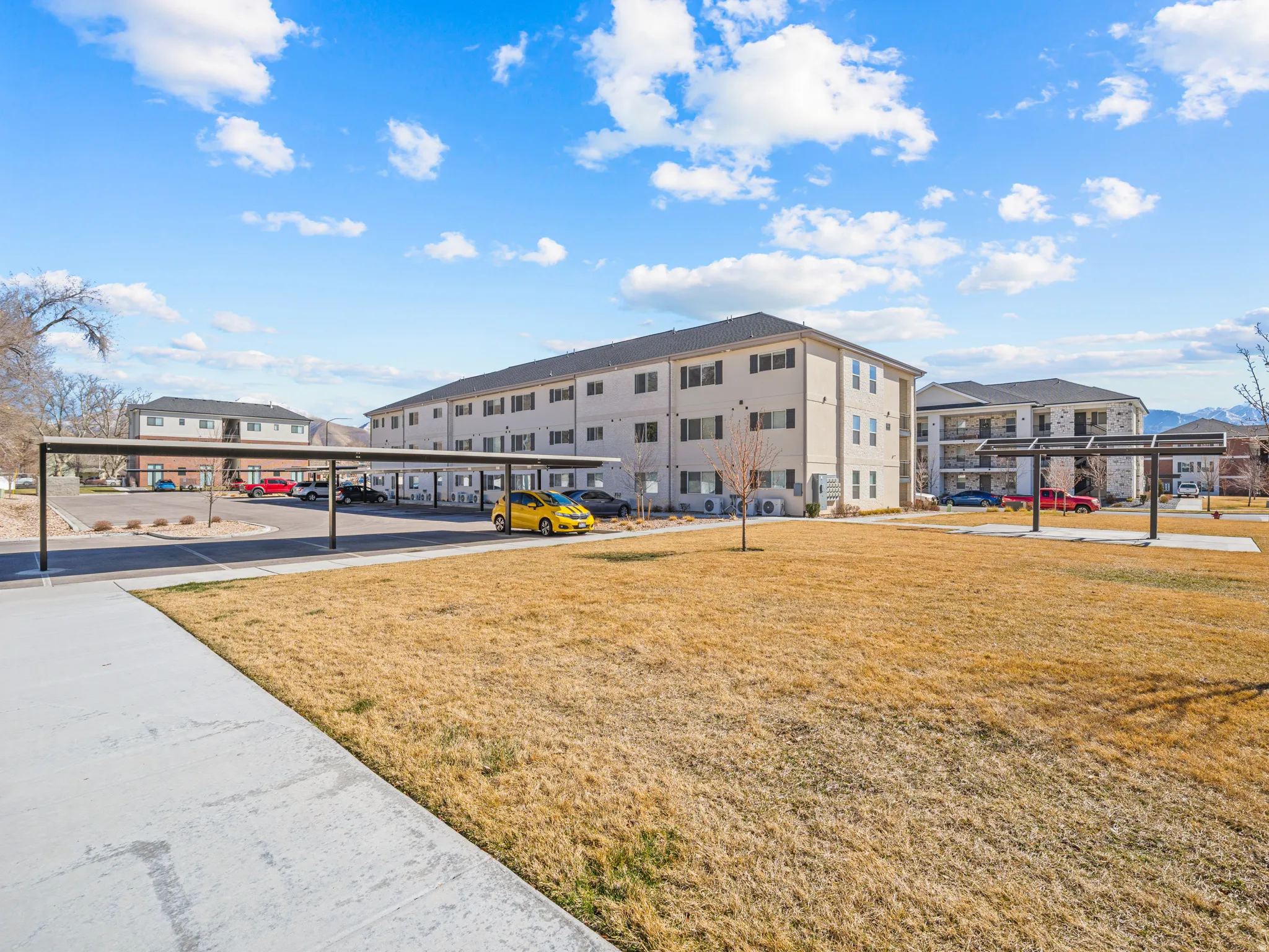 View of property with covered parking