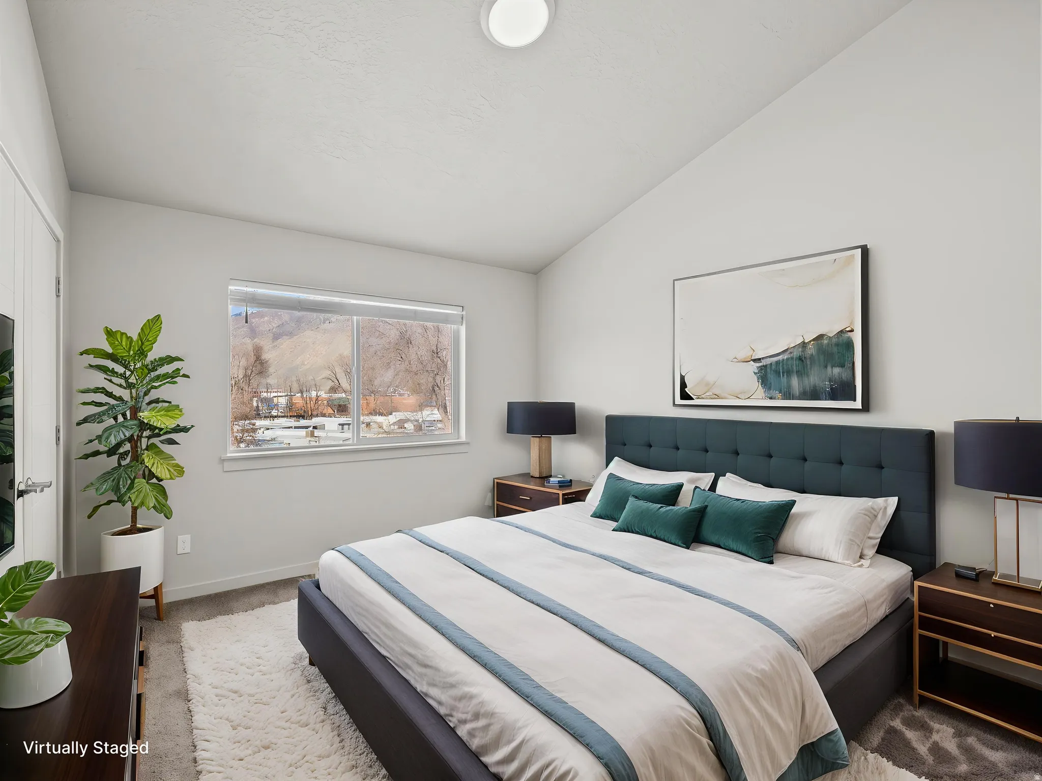 Vaulted ceiling room with light-toned walls
