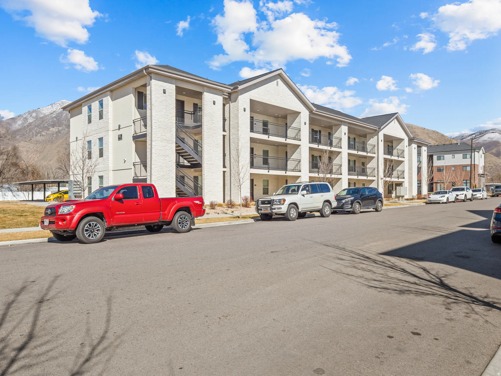 View of apartment building / complex featuring a mountain view