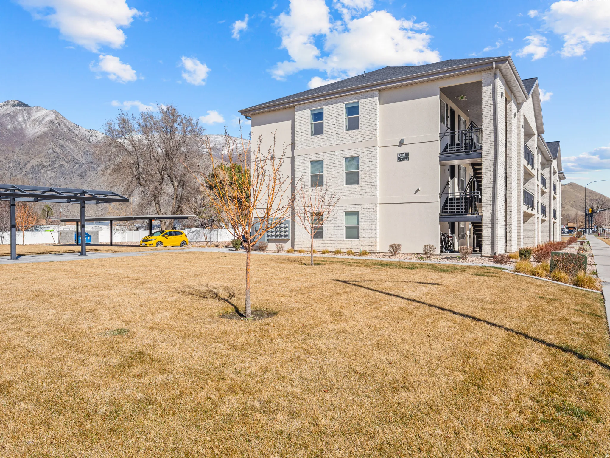 View of apartment building / complex with a mountain view and stairway