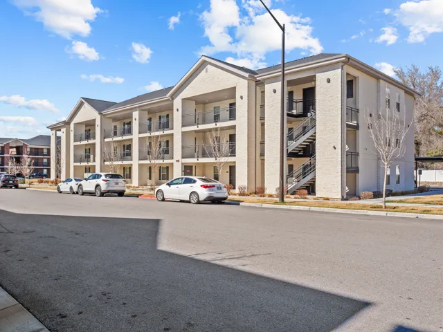 View of apartment building / complex with stairway