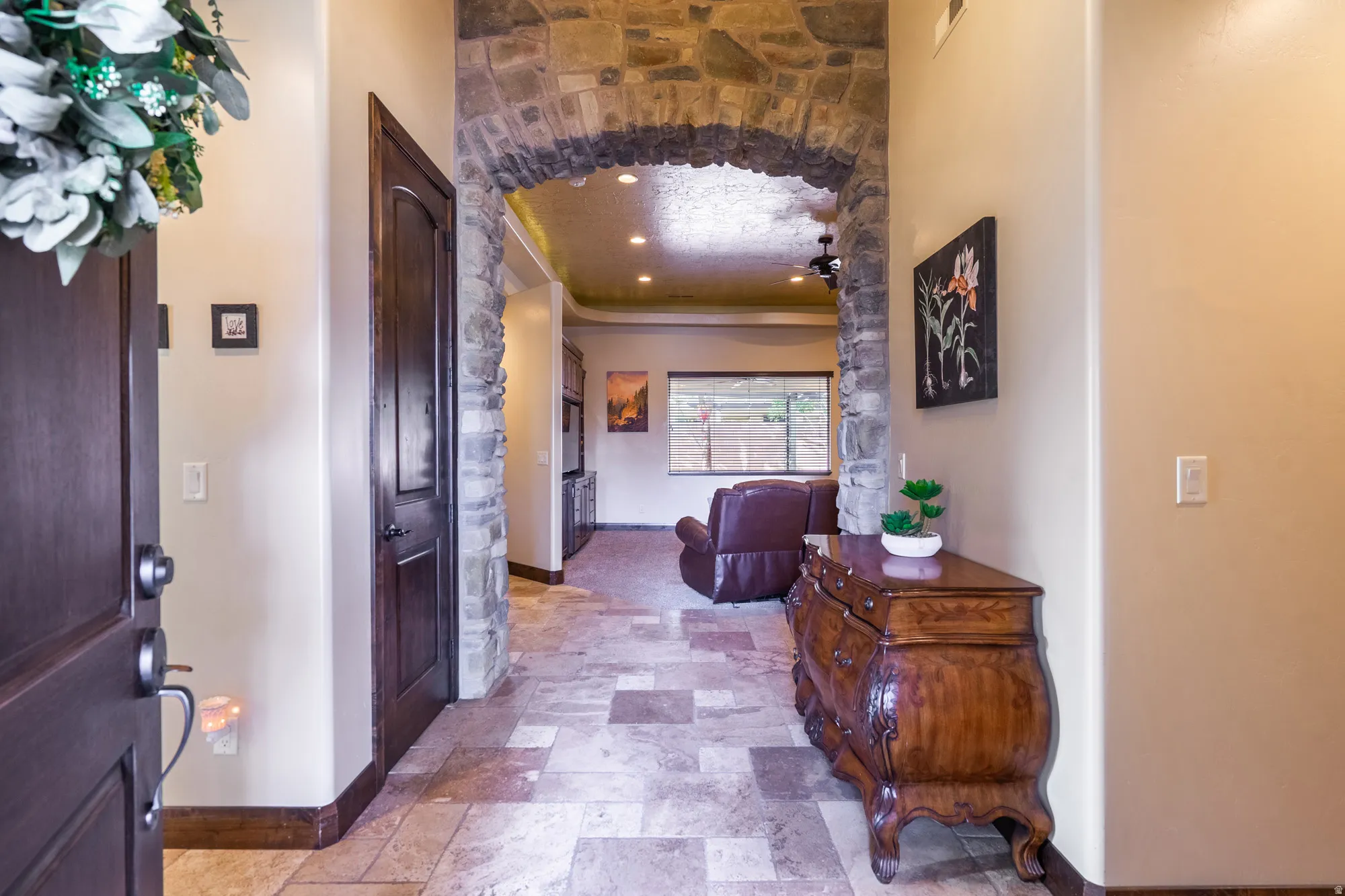 Corridor featuring light stone finish flooring and recessed lighting