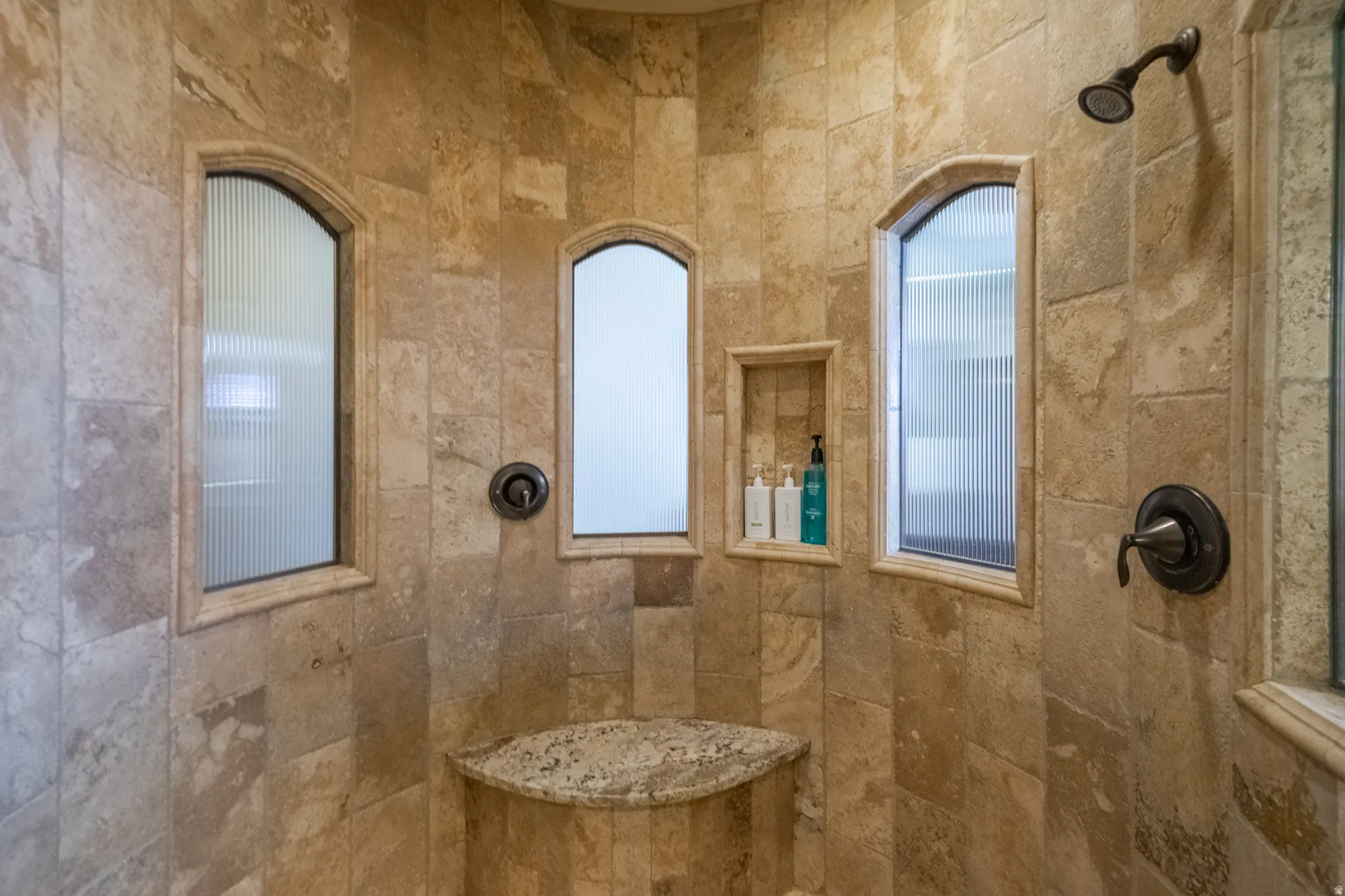 Bathroom featuring tiled shower