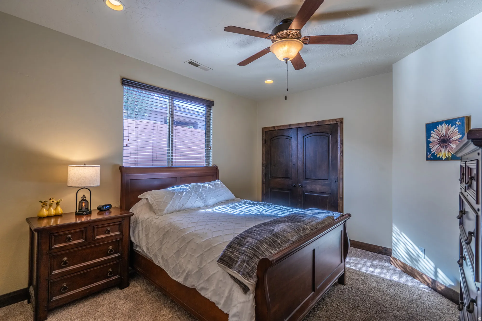 Bedroom featuring a ceiling fan, dark colored carpet, and recessed lighting