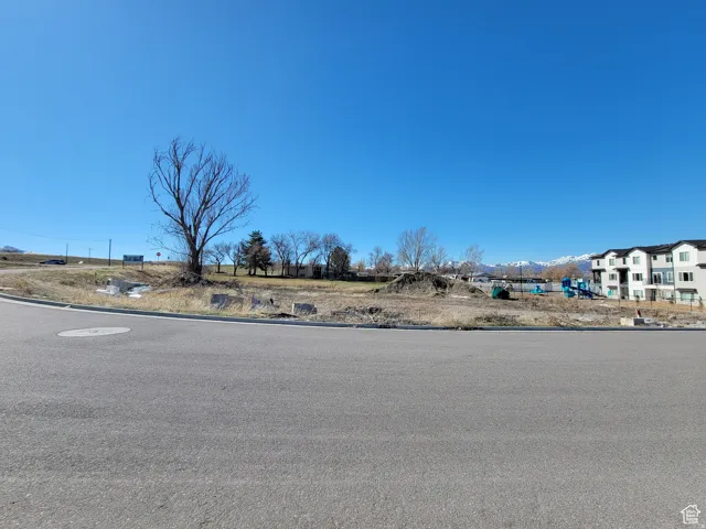 View of asphalt road with curbs