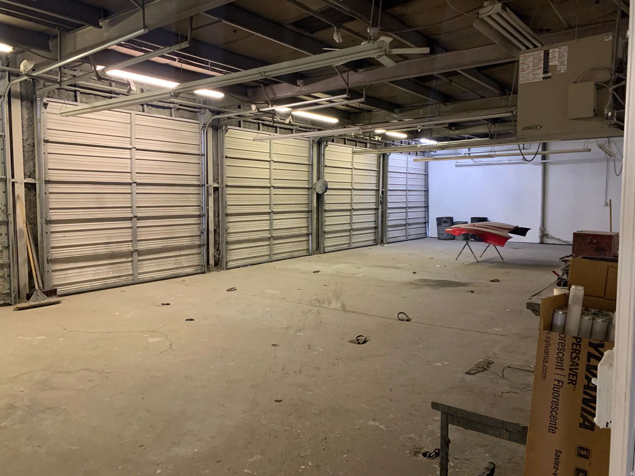 Garage featuring a heating unit