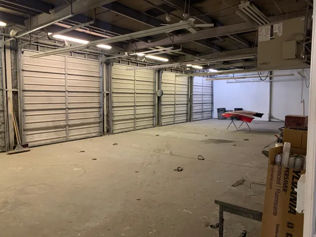 Garage featuring a heating unit