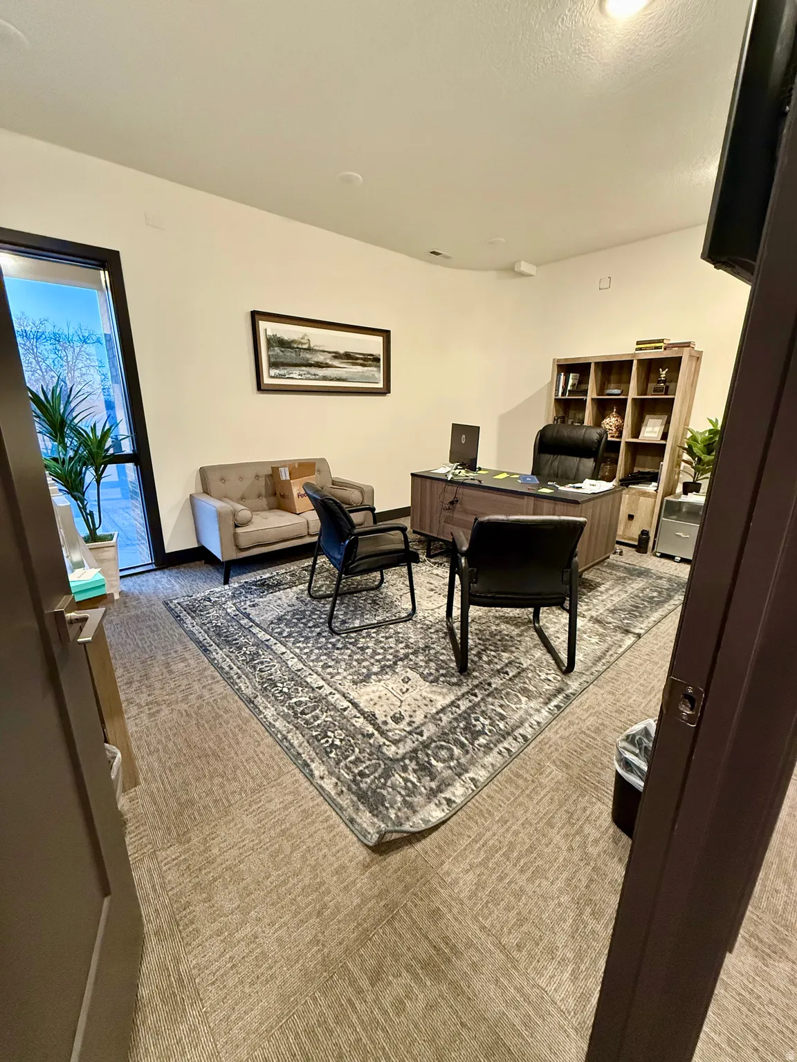 Office area featuring a textured ceiling