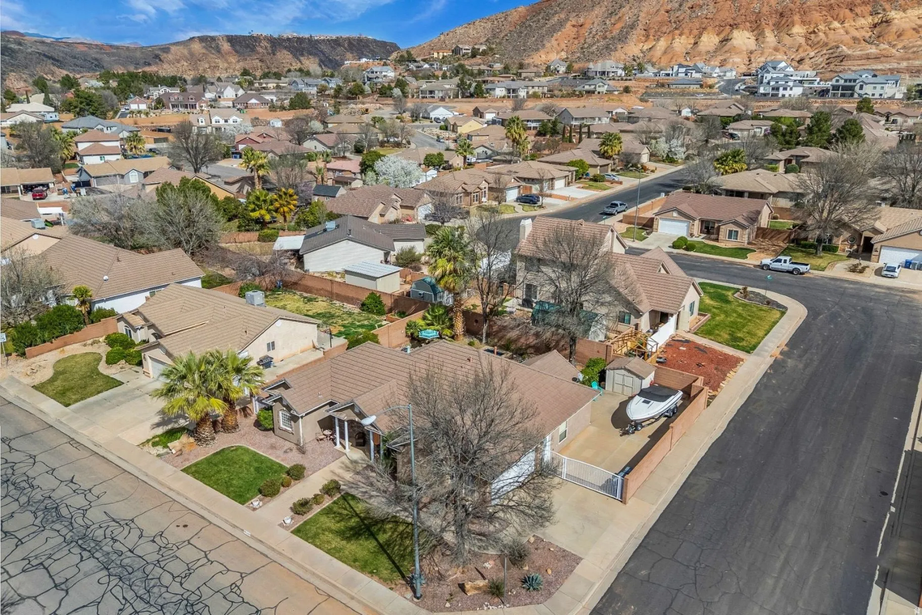 Aerial view of residential area featuring a mountainous background