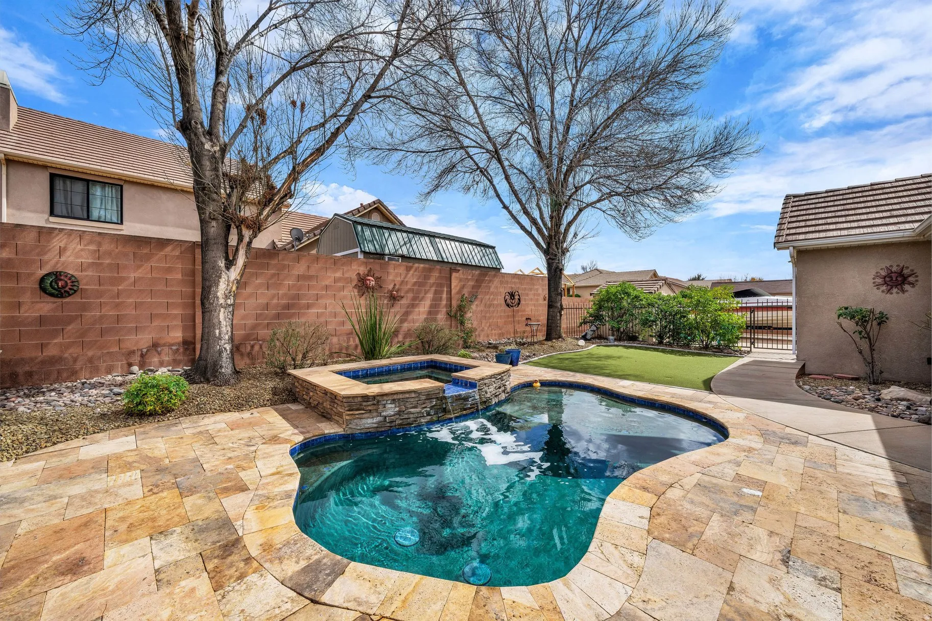 Relaxing pool / spa featuring a fenced backyard and a patio