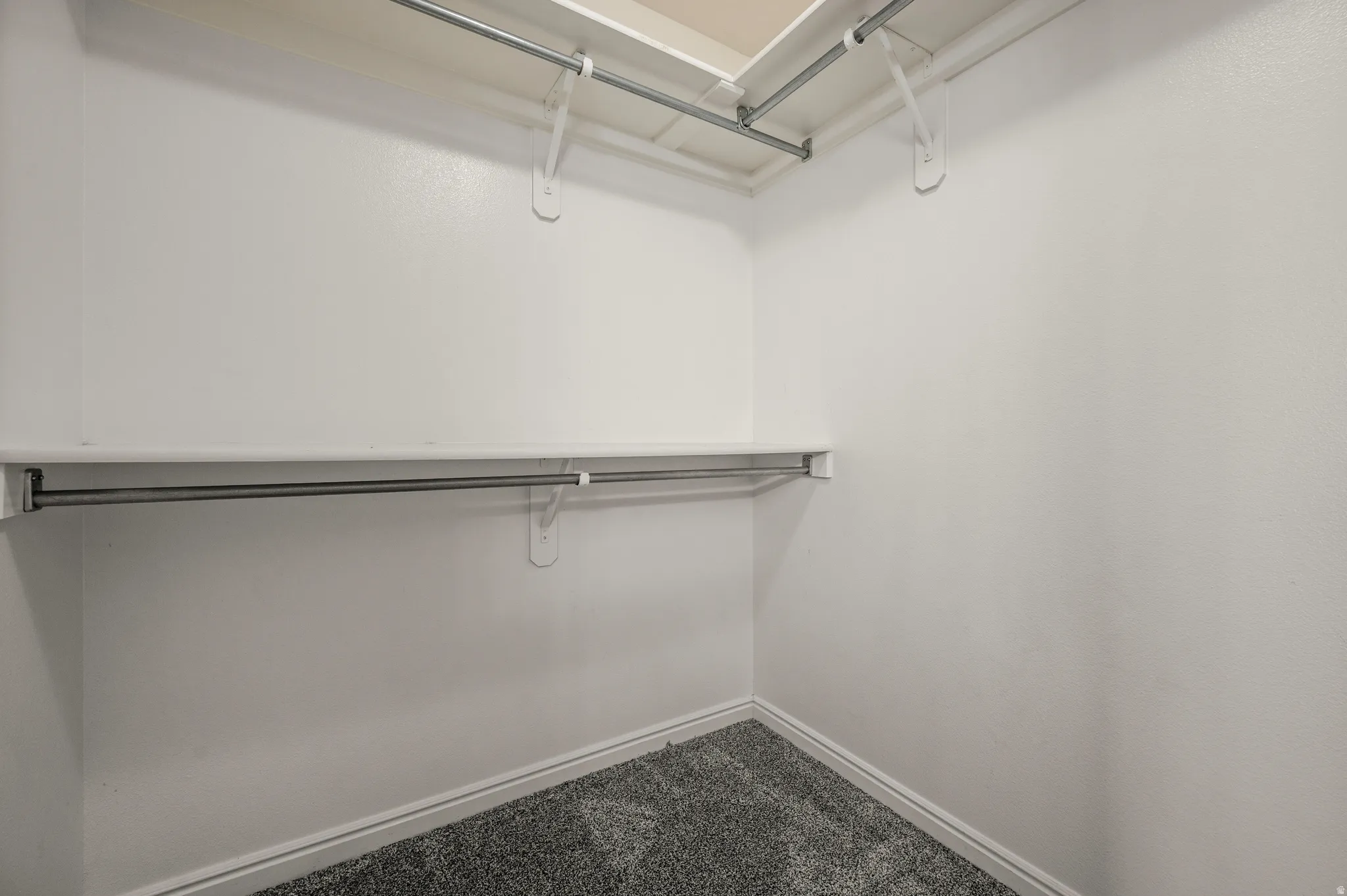 Large walk in closet in master bedroom.