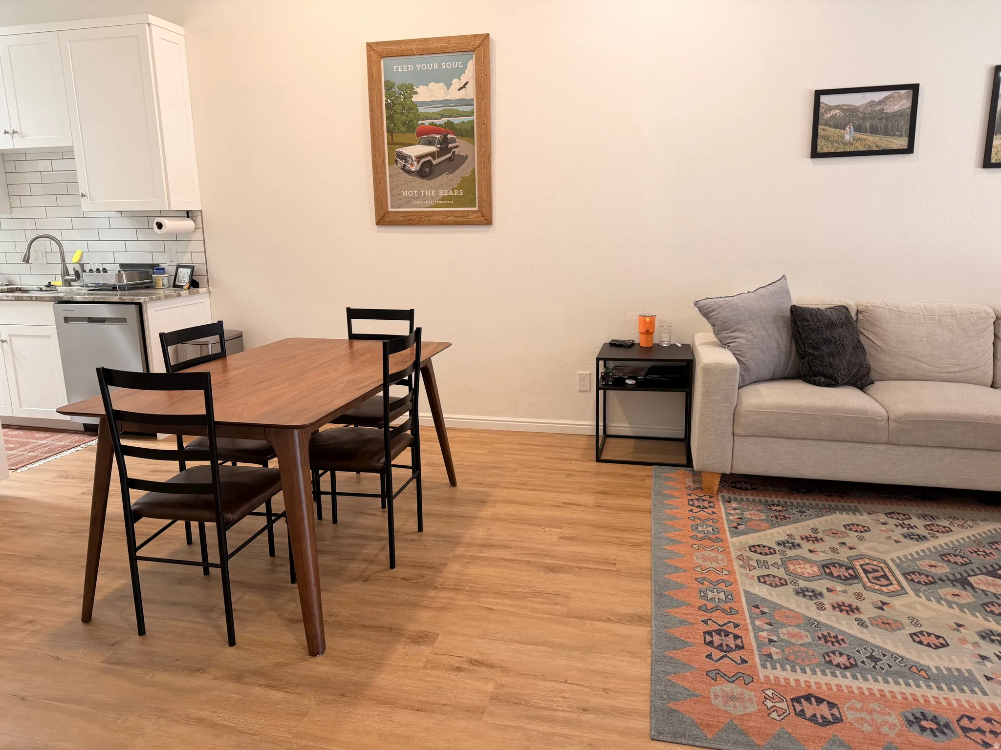 Dining room featuring light wood finished floors and baseboards